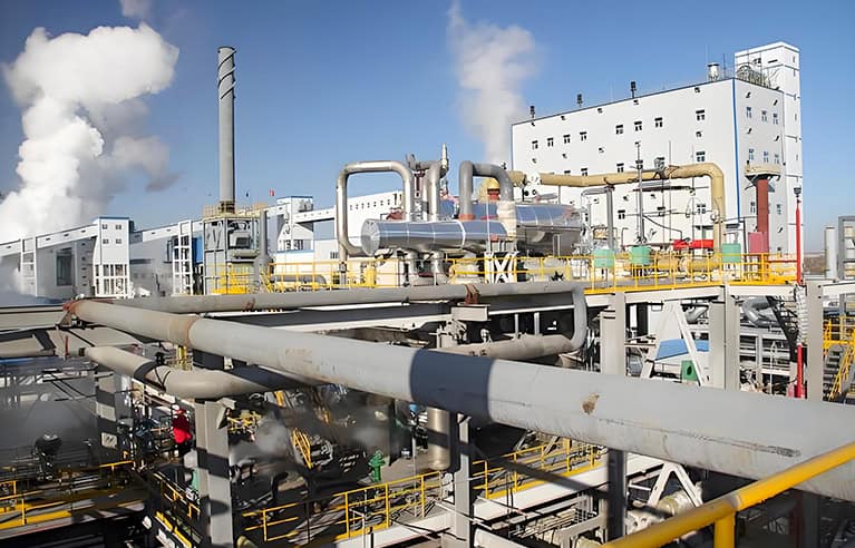 Chemical-resistant plastic valves and fittings for chlor-alkali and caustic soda storage systems