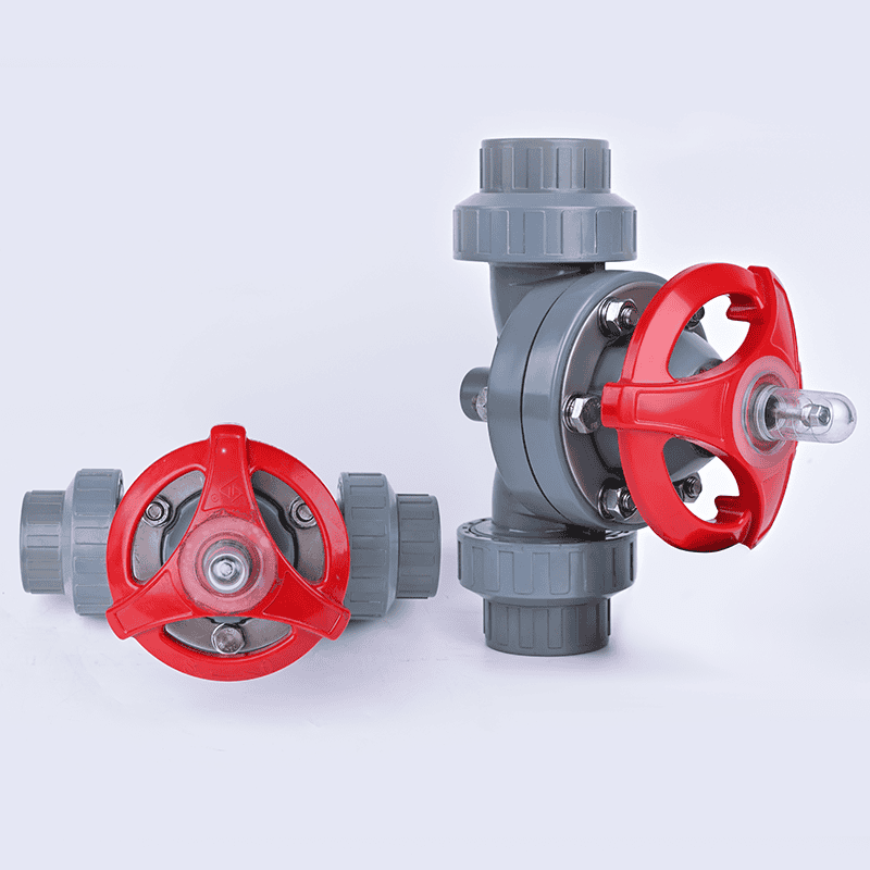Two manual socket-type CPVC plastic diaphragm valves with red handwheels displaying front and side views for hot water and industrial acid lines