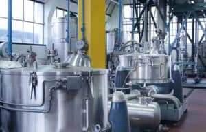 Corrosion-resistant plastic valves and fittings for industrial chemical processing plants