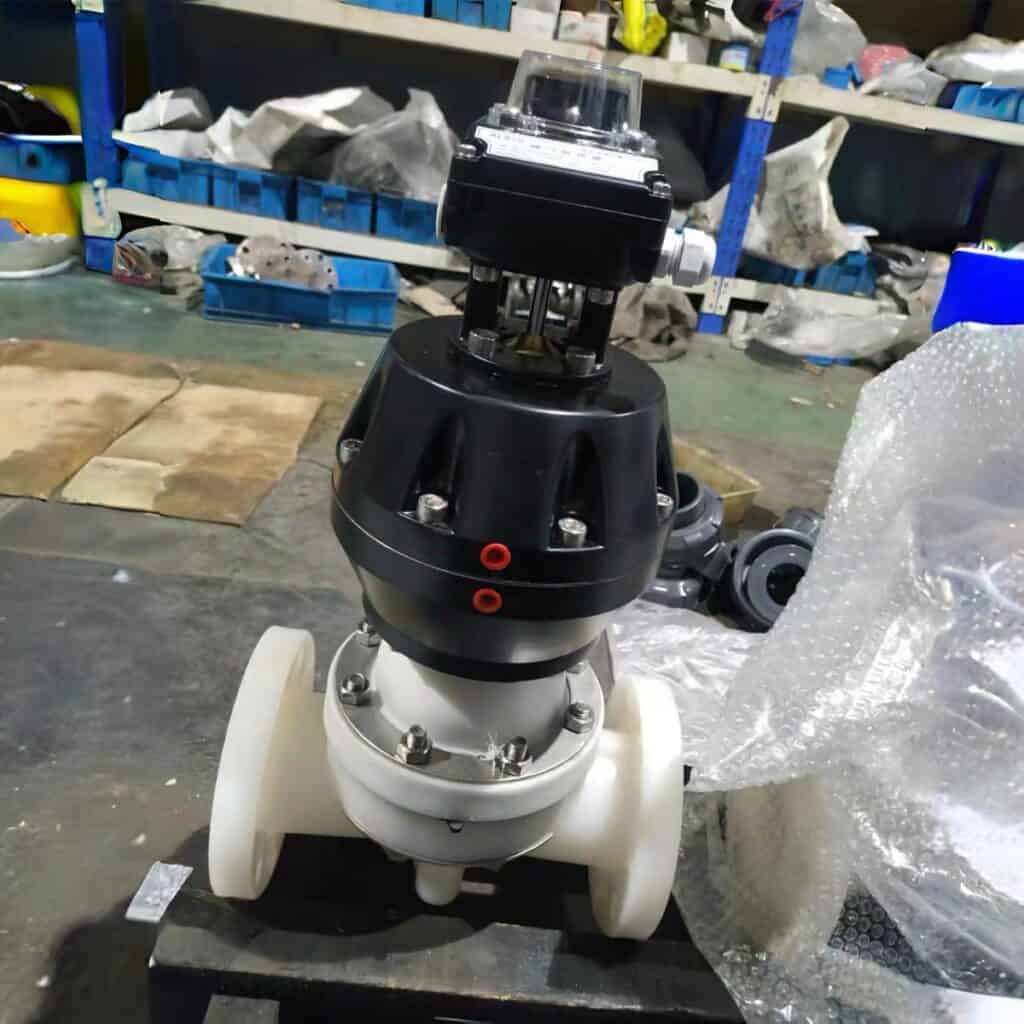 Pneumatic actuated PVDF flanged diaphragm valve with a heavy-duty linear actuator and limit switch box in a factory workshop
