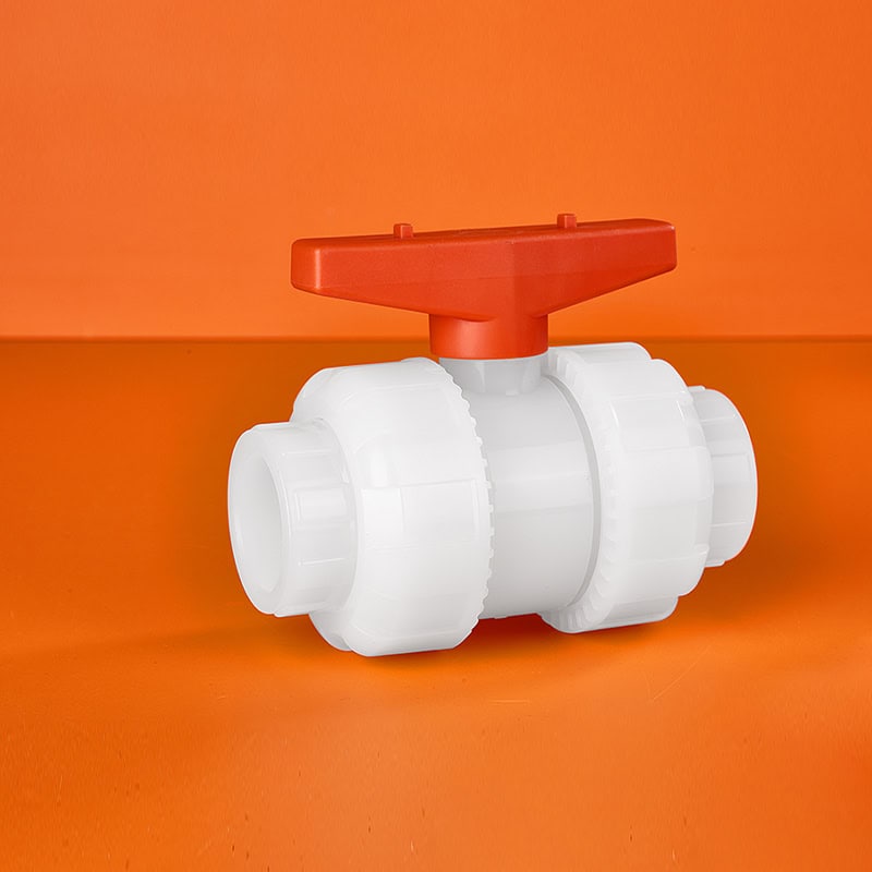 High-purity virgin PVDF manual true union ball valve with a bright red handle for semiconductor and chemical processing applications