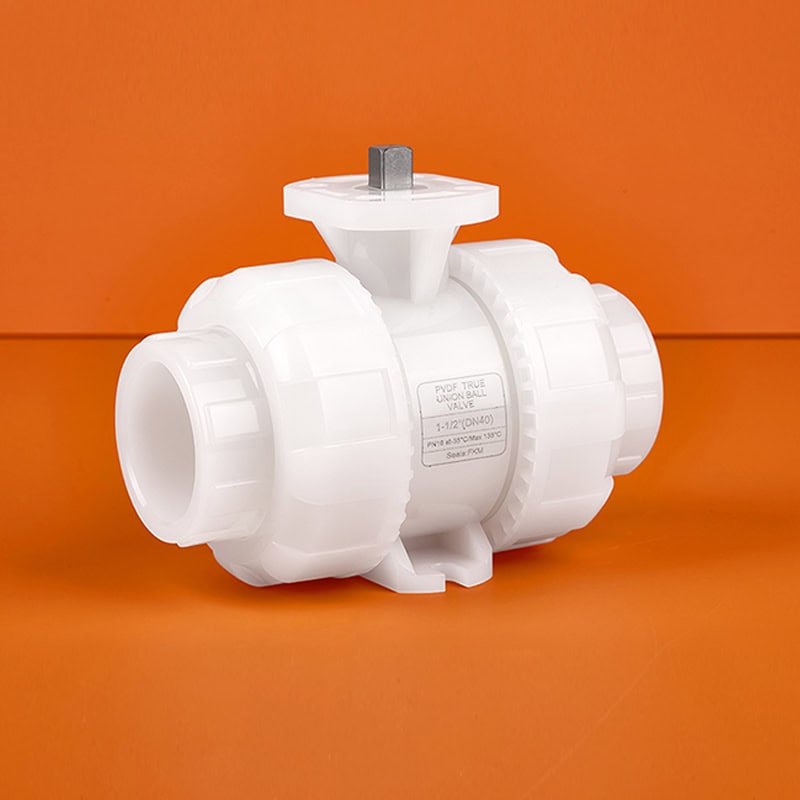 High-purity PVDF true union ball valve body without handle, featuring an ISO 5211 mounting pad for pneumatic or electric actuators