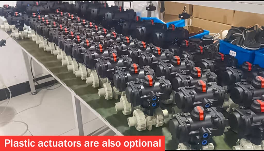 Batch of industrial plastic valves and fittings featuring corrosion-resistant all-plastic pneumatic actuators on true union ball valves in our assembly workshop